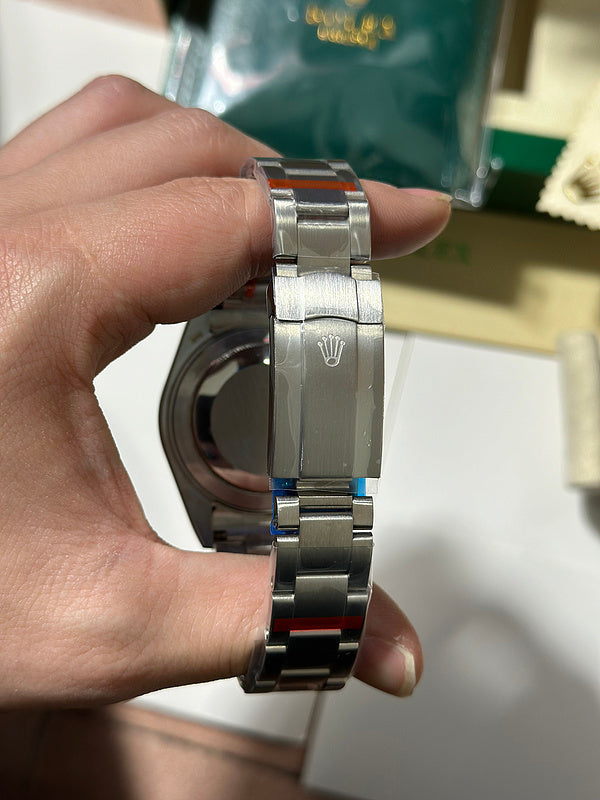 Rolex Oyster Perpetual 41 with Coral Red Dial Watch