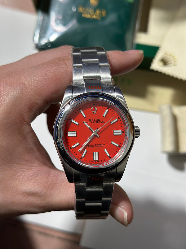 Rolex Oyster Perpetual 41 with Coral Red Dial Watch